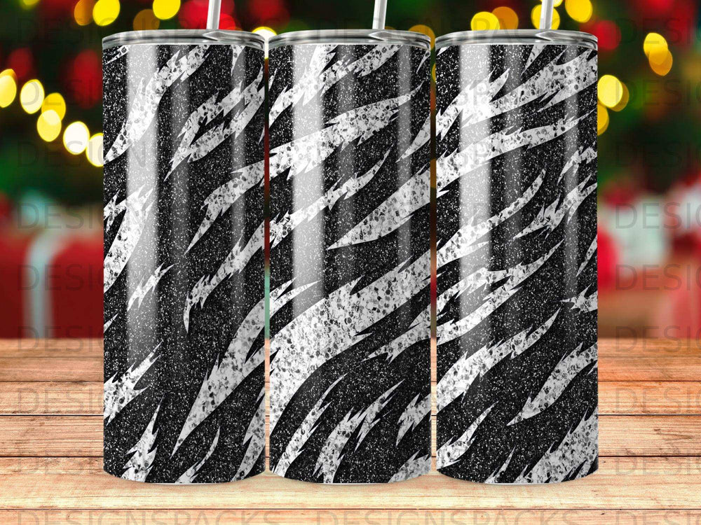 Black and white zebra print insulated tumbler with straw.