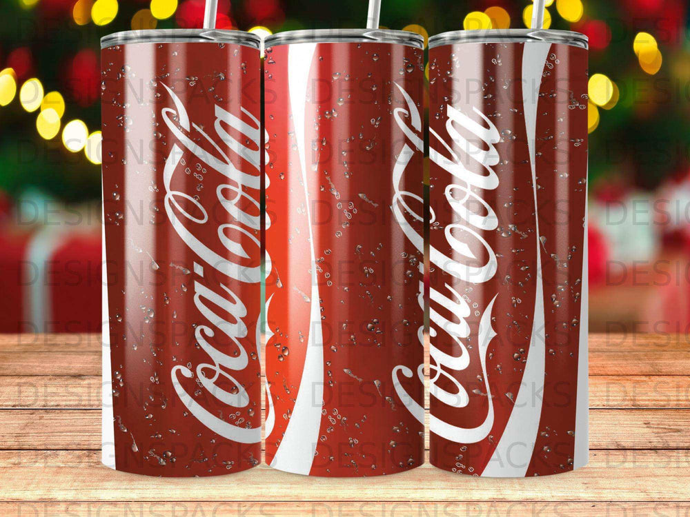 Three Coca-Cola tumblers with condensation, featuring the iconic logo.