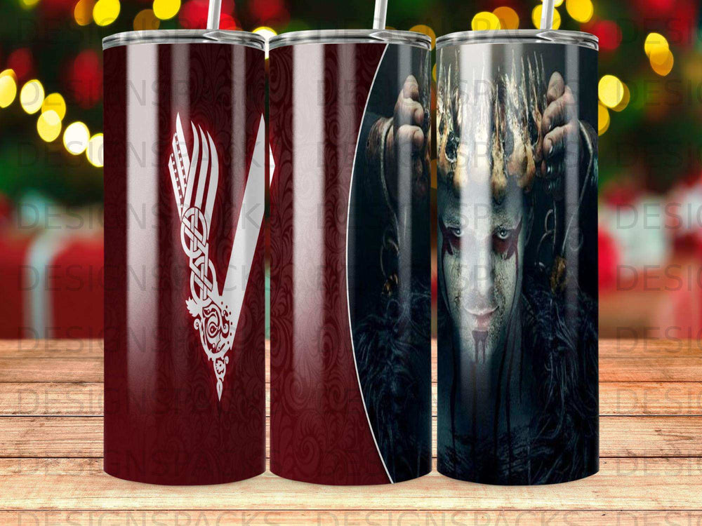 Viking design tumbler with red and white patterns and a warrior's face.