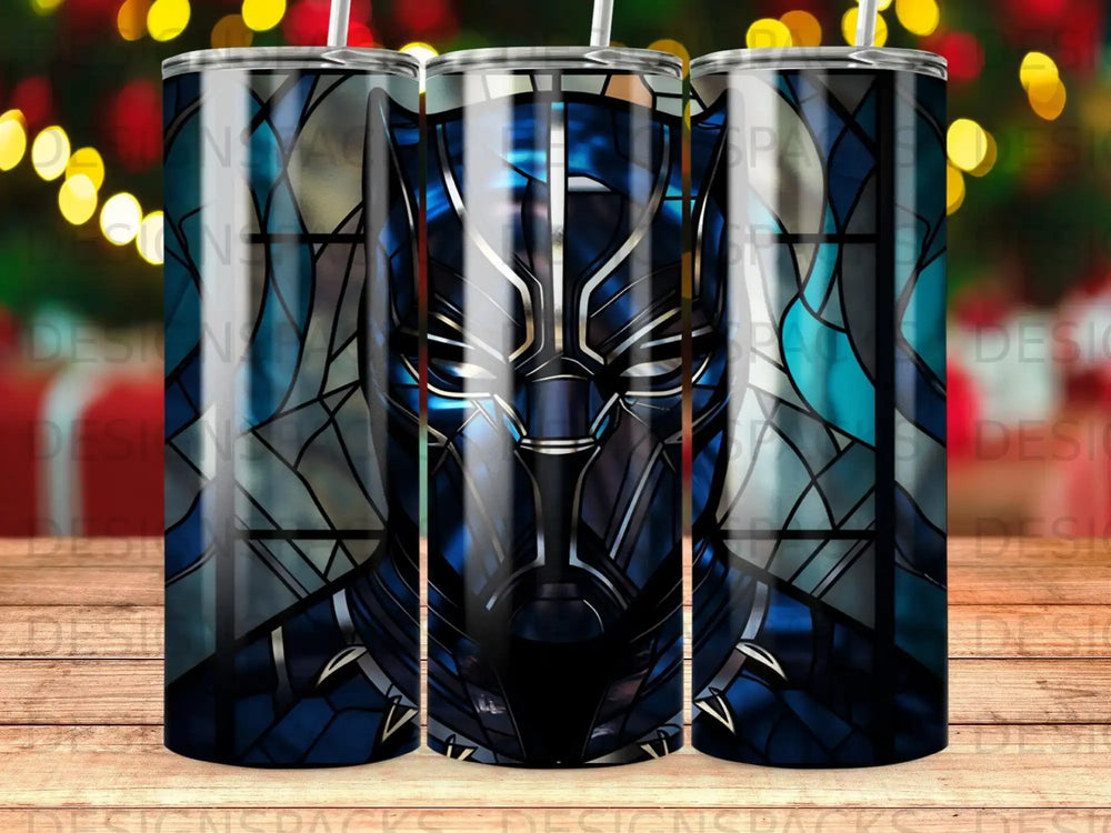 Black Panther mask graphic on a tumbler with a blurred festive background.
