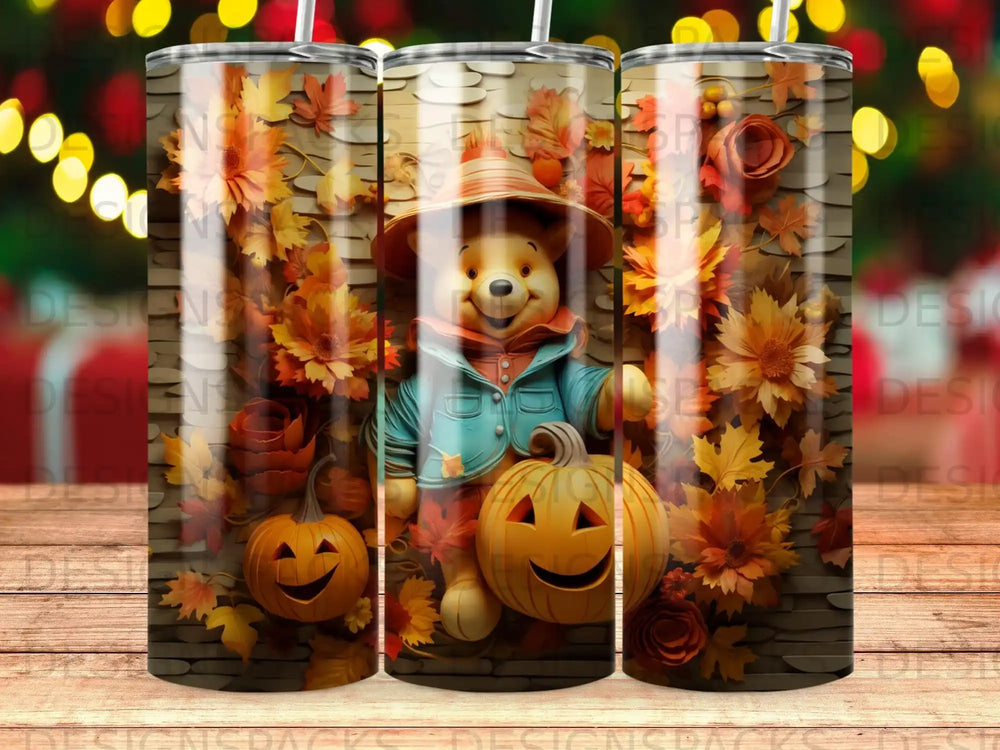 Winnie the Pooh in a blue jacket with pumpkins and autumn leaves.
