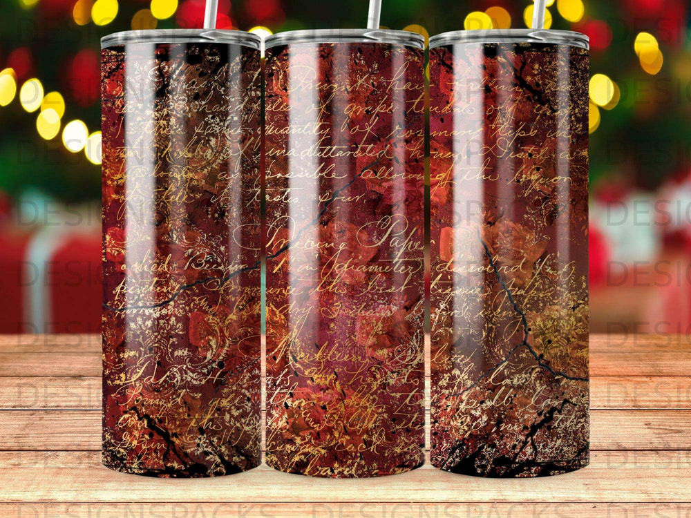 Dark red tumbler with gold script pattern and visible crackle texture.