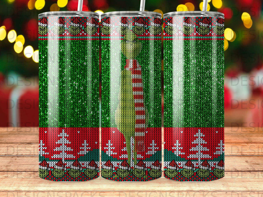 Christmas tumbler with Grinch and tree pattern.