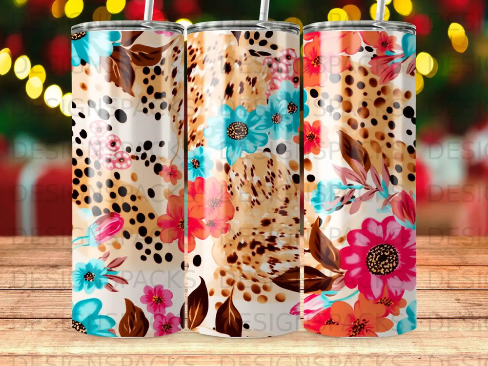 Floral and leopard print tumbler with straw, bright colors, white background.