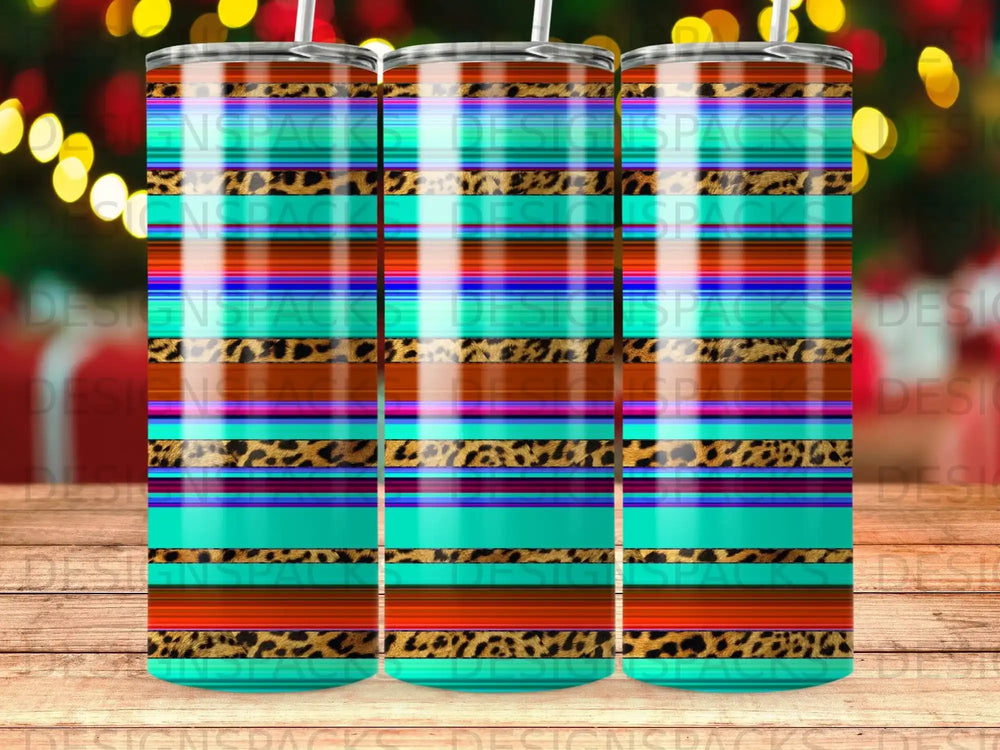 Patterned tumbler with turquoise, orange, brown, and leopard print stripes.