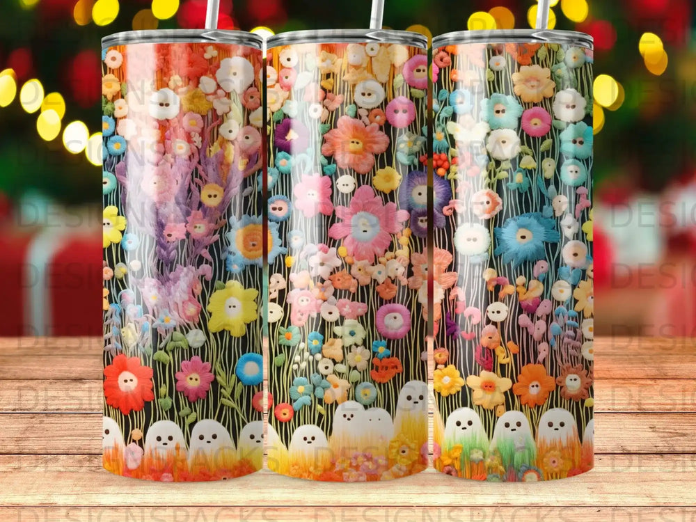 Three tumblers with a floral ghost pattern on a dark background.