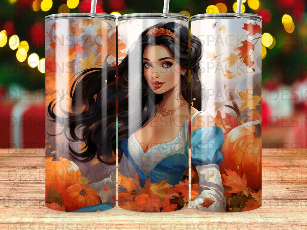 Woman in blue dress with pumpkins and fall leaves.