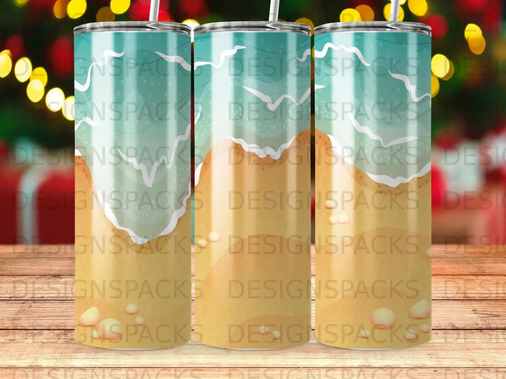 Three tumblers with a beach scene design featuring waves and sand.