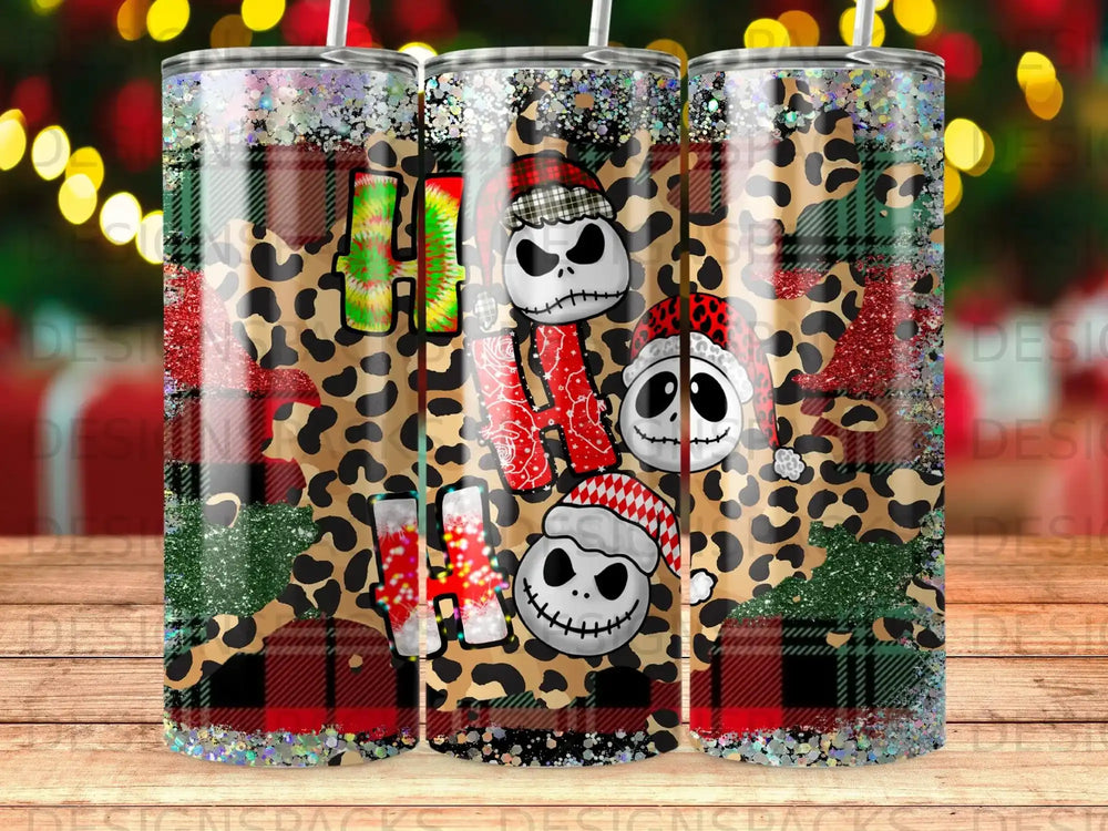 Three tumblers with "Ho Ho Ho" and Jack Skellington designs on leopard and plaid backgrounds.