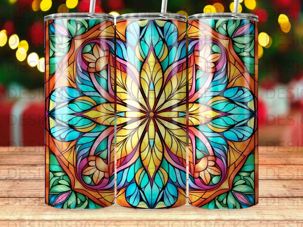 Three tumblers with a stained glass mandala design in vibrant colors.