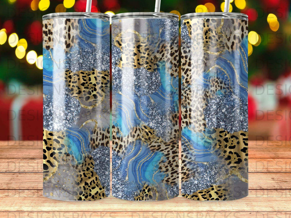 Abstract blue, gold, and leopard print tumbler design.