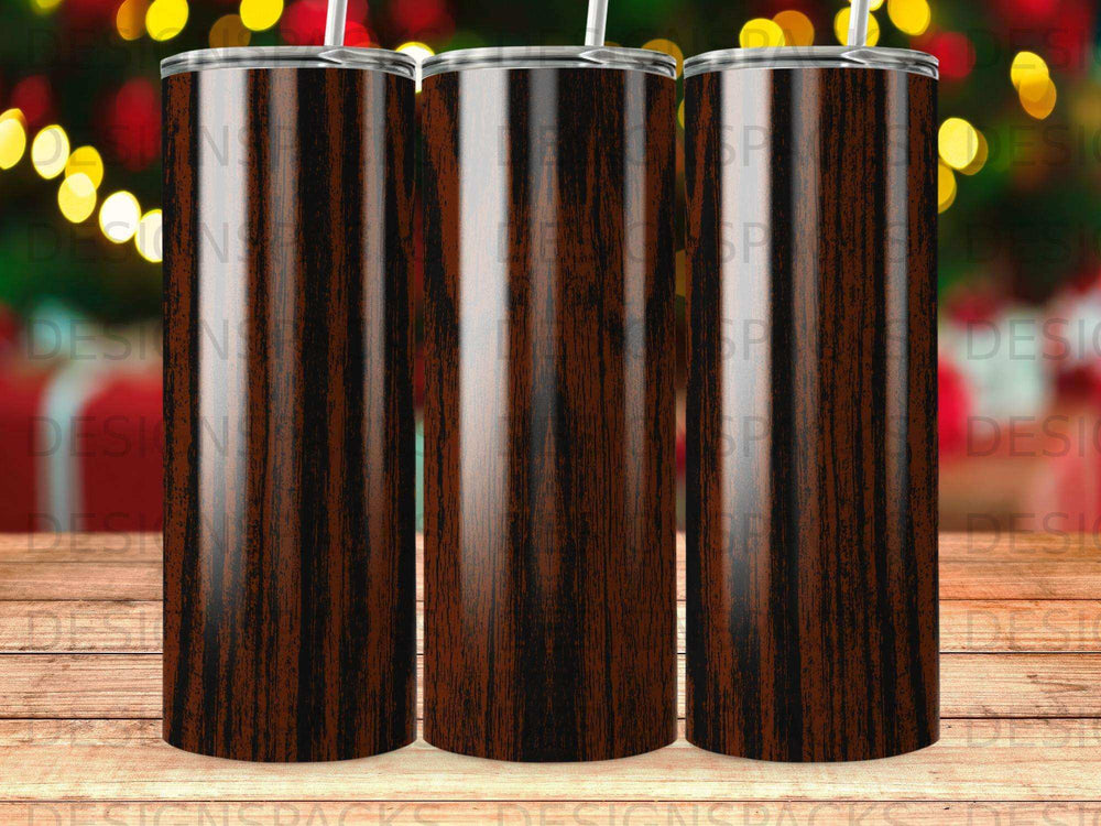 Three tall, wood-grain tumblers with lids and straws against a bokeh background.