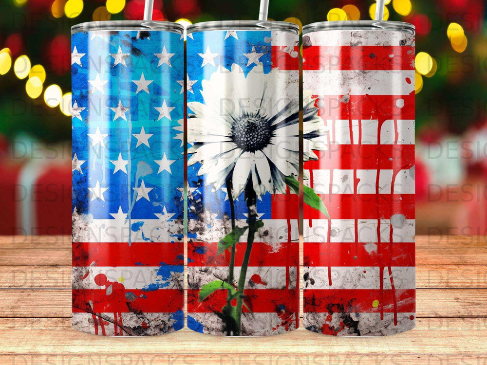 American flag tumbler with white daisy and red splatters.