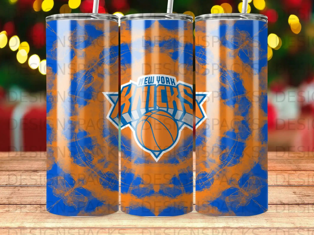 New York Knicks basketball team logo on a blue and orange tie-dye tumbler.