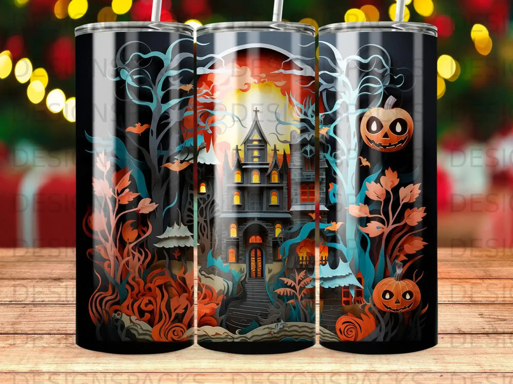 Spooky haunted mansion with pumpkins and bats on a Halloween-themed tumbler.