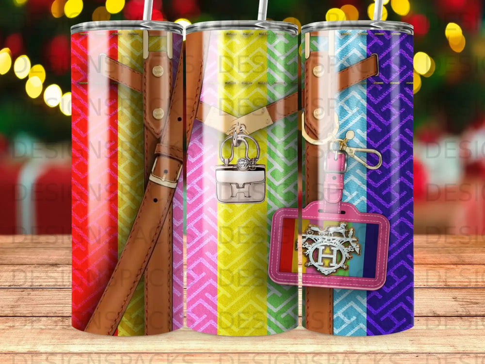 Three tumblers with colorful patterned straps and a small handbag charm.