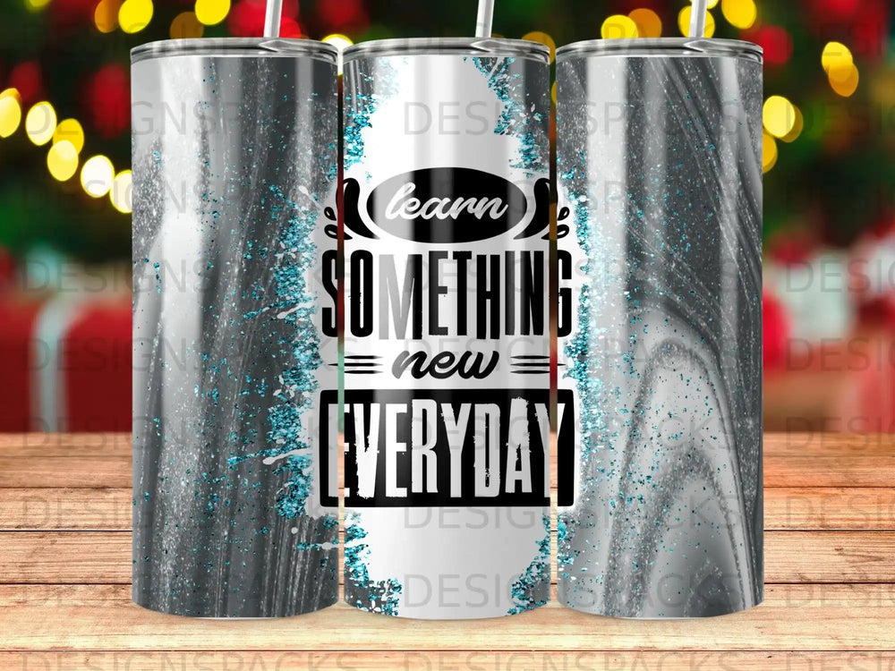 Tumbler with "Learn Something New Everyday" text and speckled gray design.