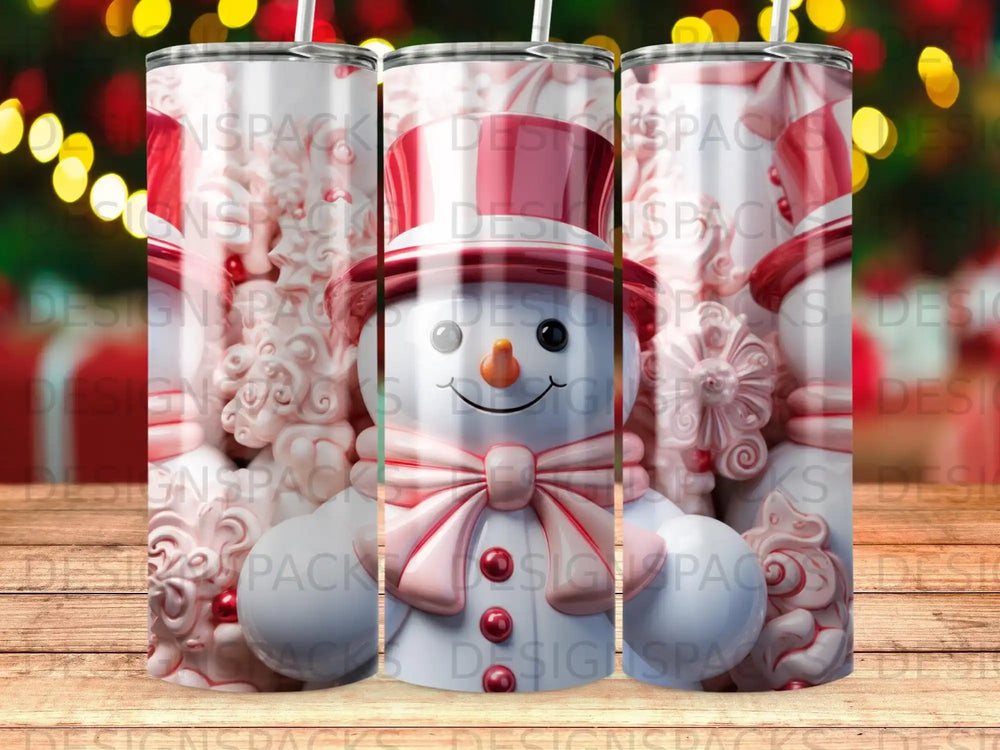 Three snowmen tumblers with red bows and hats on a wooden background.