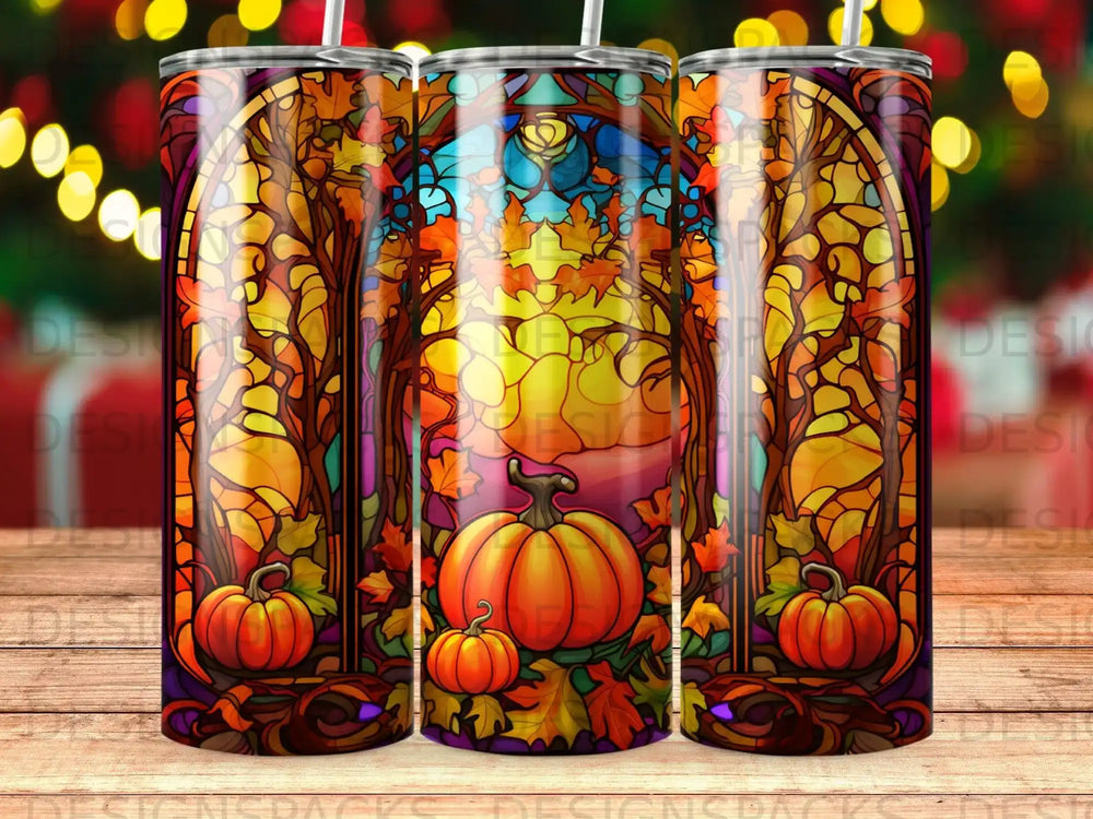 Stained glass tumbler with pumpkins, fall leaves, and trees.