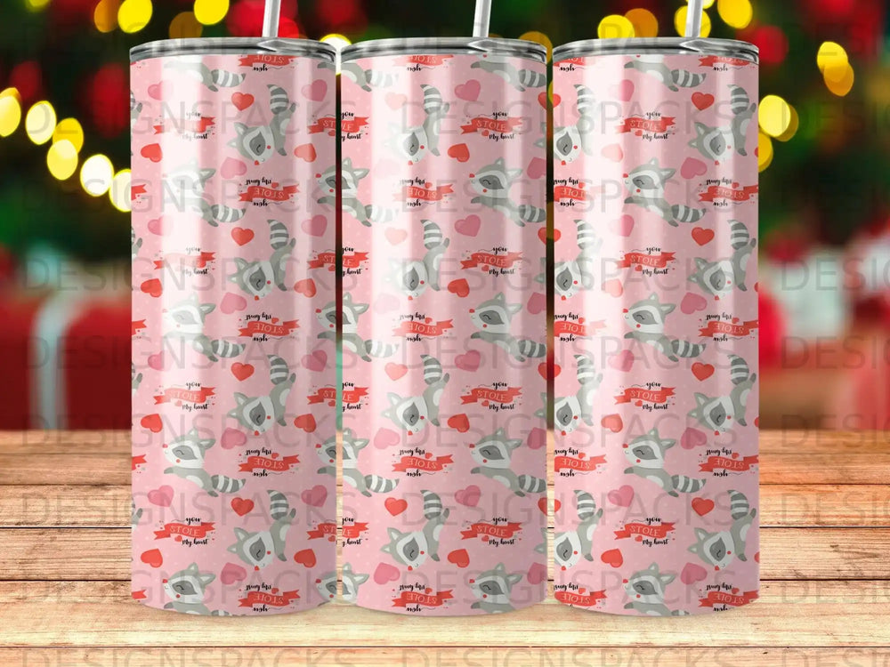 Pink tumbler with repeating heart and "you stole my heart" text.