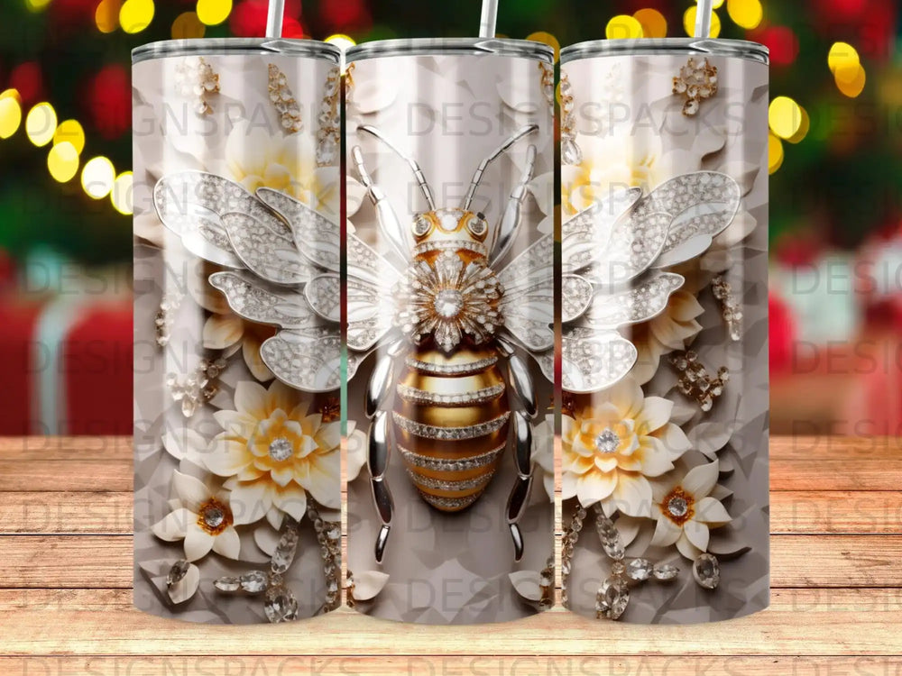 Bee adorned with jewels and flowers on a tumbler.