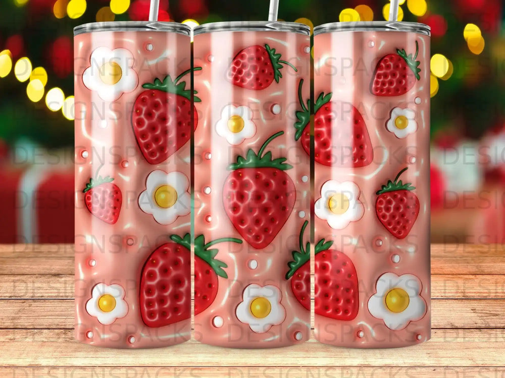 Tumbler with red strawberries and white flowers on a pink background.