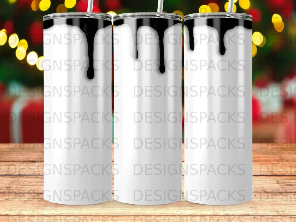 Three white tumblers with black liquid dripping from the top.