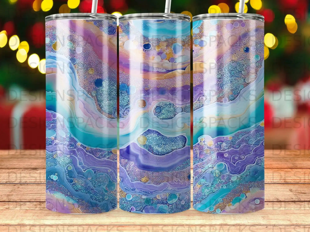 Three tumblers with a swirling purple, blue, and gold marbled design.
