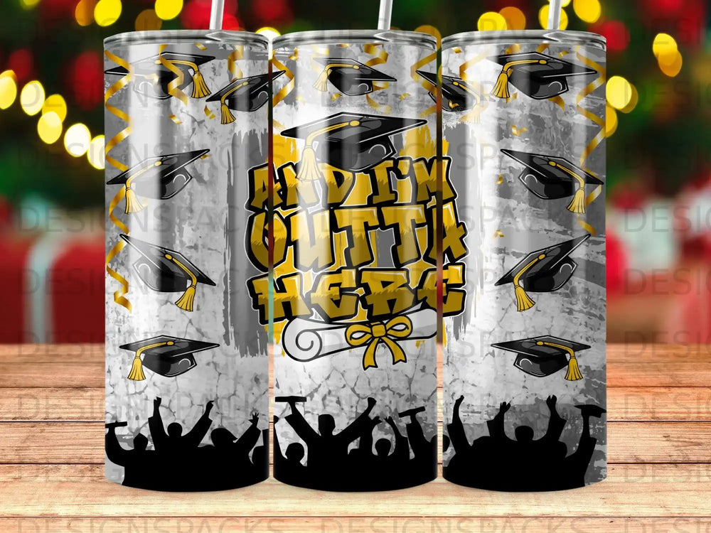 Graduation caps and diplomas surround text reading "DREAM BIG" on a tumbler design.