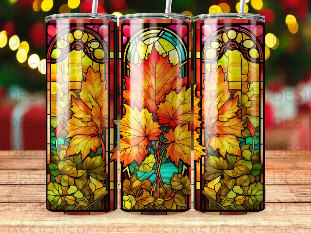 Stained glass pattern with autumn leaves and warm light.