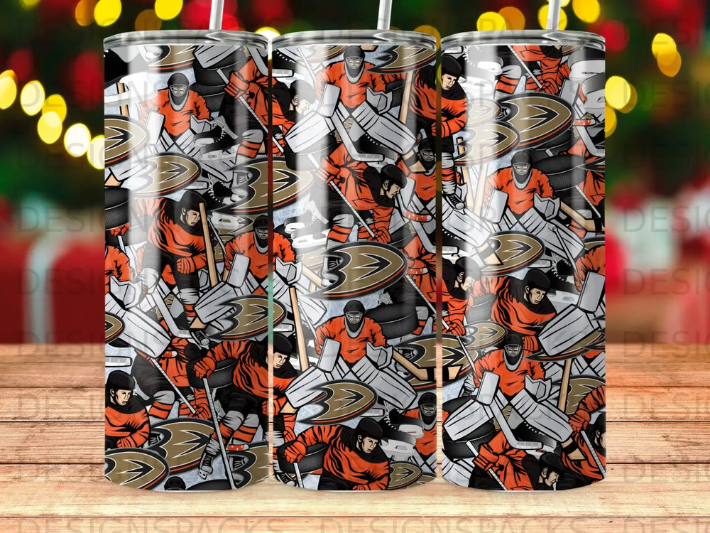 Orange and black hockey players pattern on a cylindrical tumbler.