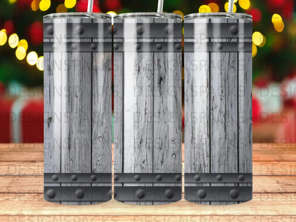 Wooden barrel texture tumbler with metal bands and bokeh background.