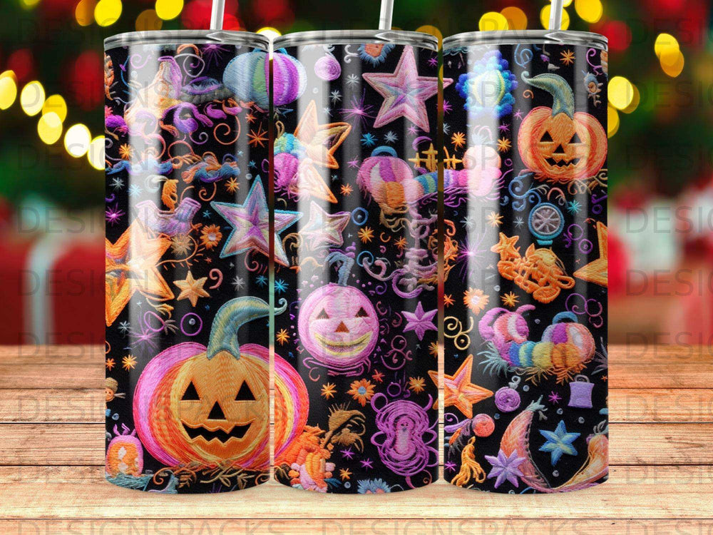 Three tumblers with colorful Halloween patterns and designs.