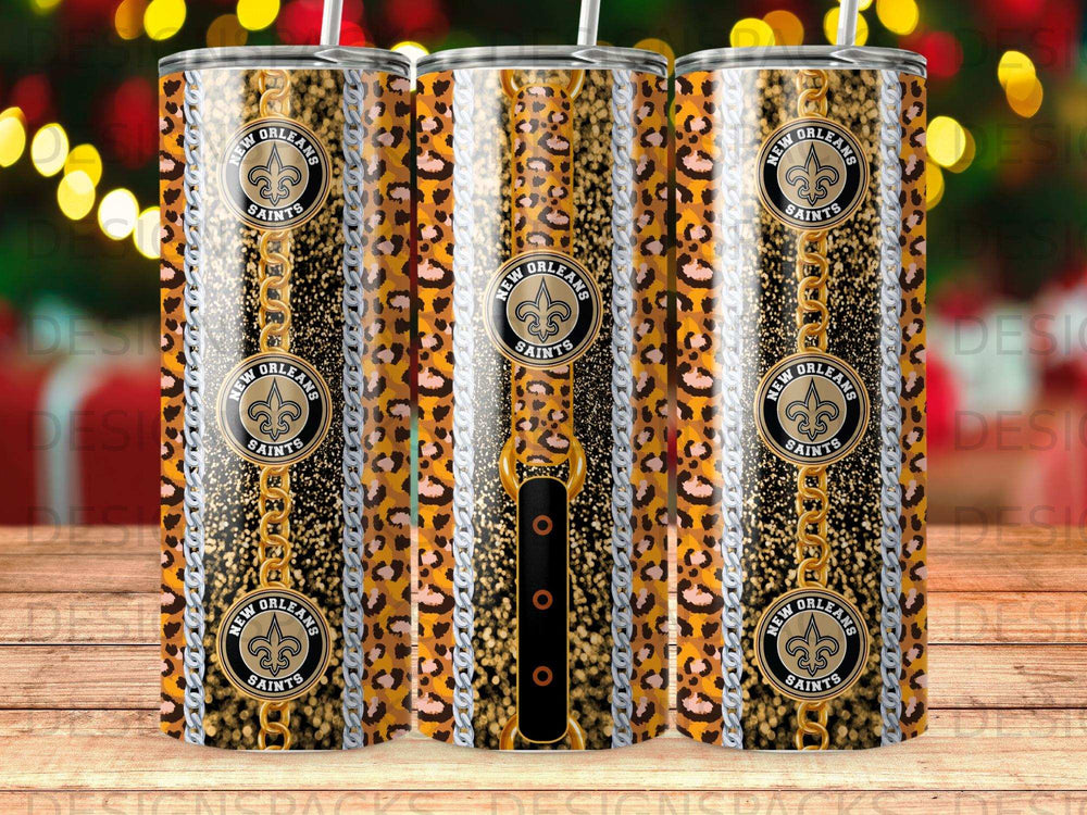 New Orleans Saints tumbler with leopard print, gold chains, and metallic accents.