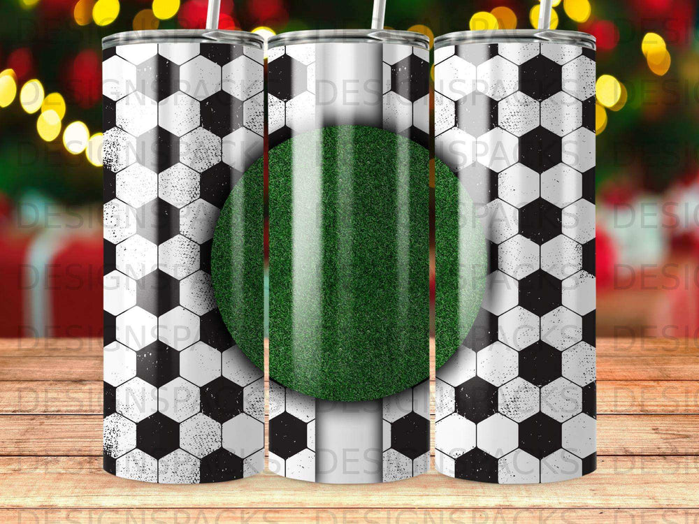 Soccer ball pattern tumbler with a green grass stripe.