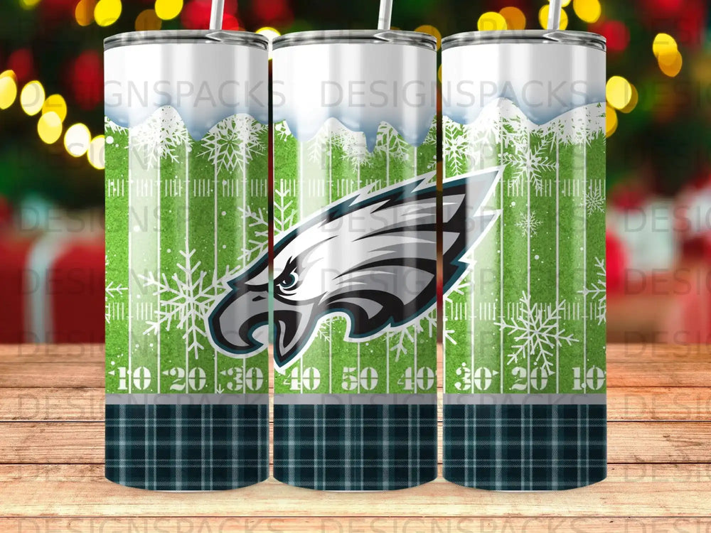 Philadelphia Eagles logo on a football field themed tumbler.