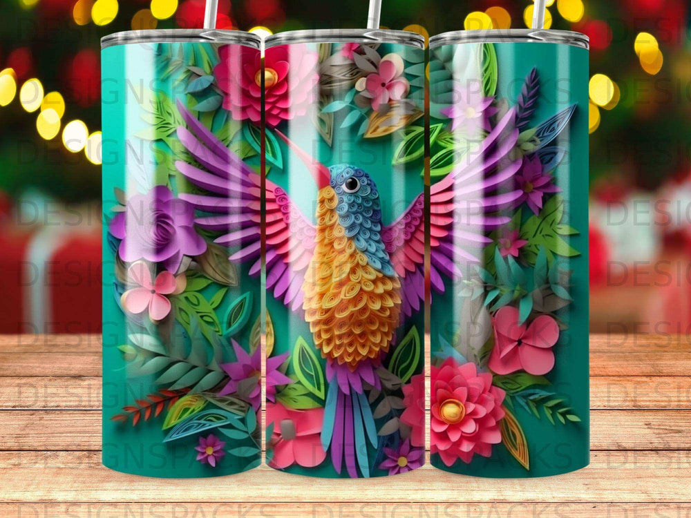 Hummingbird and floral design on a teal tumbler with bright, colorful wings.