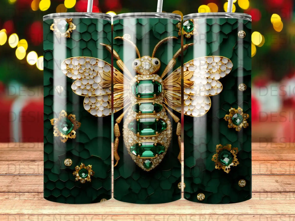 Bee tumbler with emerald and diamond accents on honeycomb pattern.