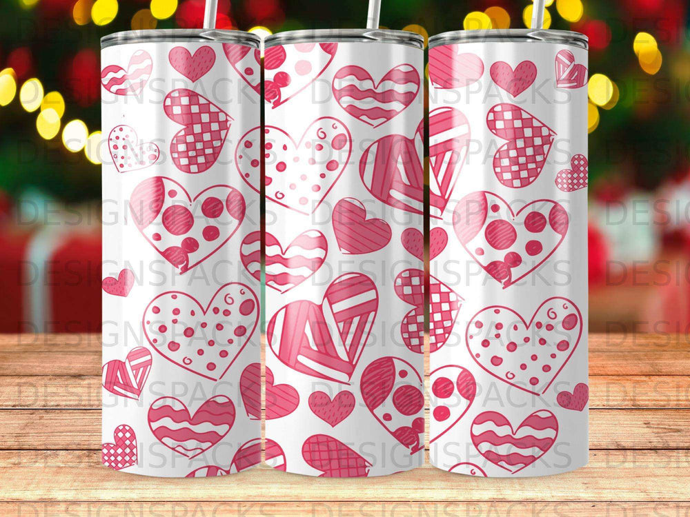 Pink and white patterned hearts on a cylindrical tumbler.