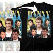 Black t-shirt featuring "Danny Zuko" graphic with cast members from Grease.