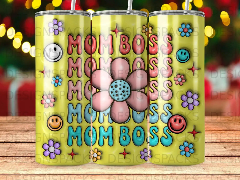 Mom Boss tumbler with floral and smiley face graphics.