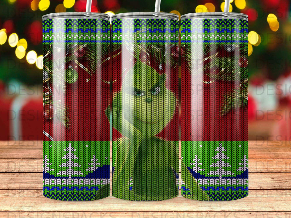 Green Grinch character in festive knitted pattern on a tumbler.