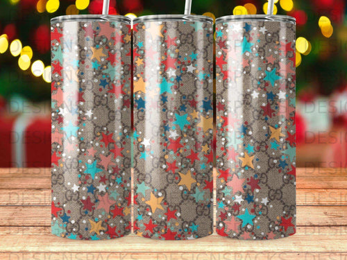Tumbler with repeating brown GG pattern and colorful star accents.