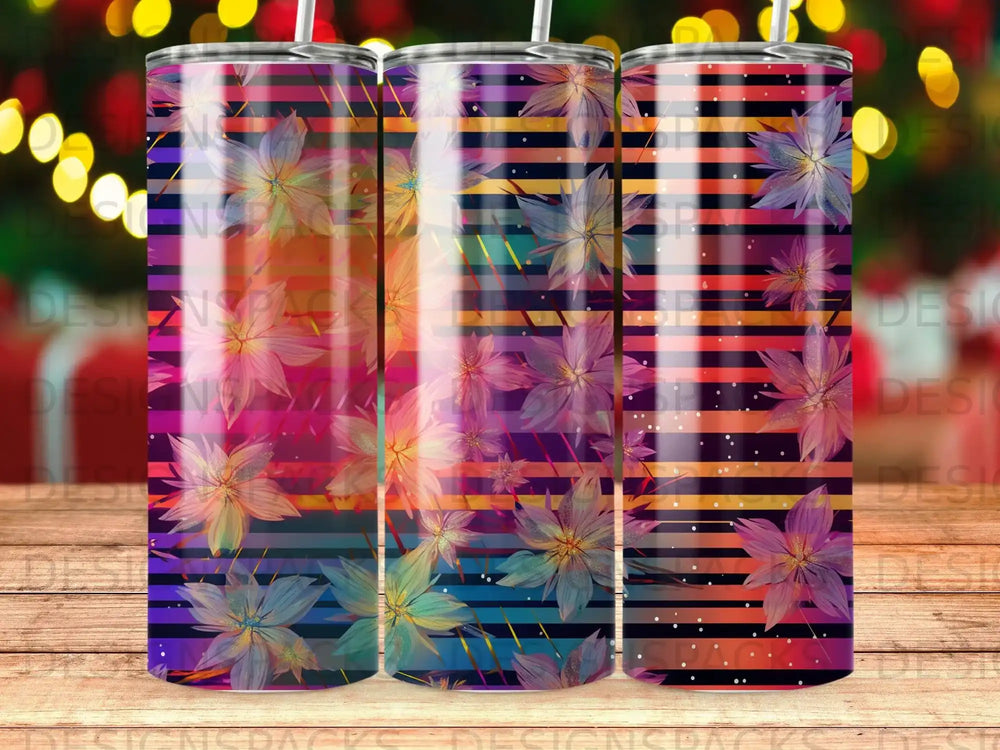 Three tumblers with floral and striped designs, vibrant purple and blue colors.