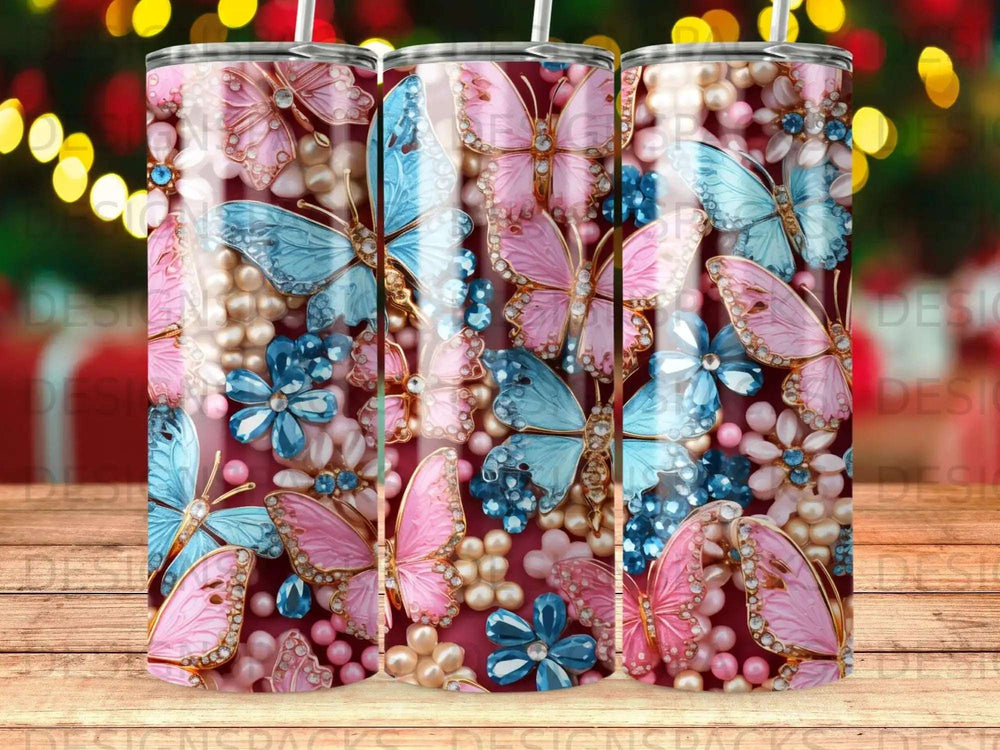 Pink and blue butterflies and flowers with pearl and gem embellishments on a tumbler.
