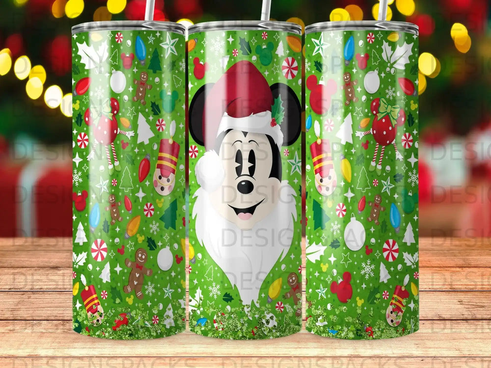 Mickey Mouse in Santa hat with Christmas ornaments and gingerbread on a green patterned tumbler.