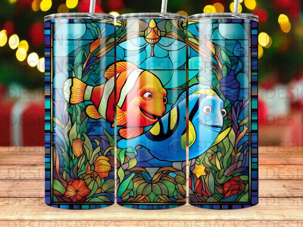 Stained glass art featuring Nemo and Dory swimming among coral and sea anemones.