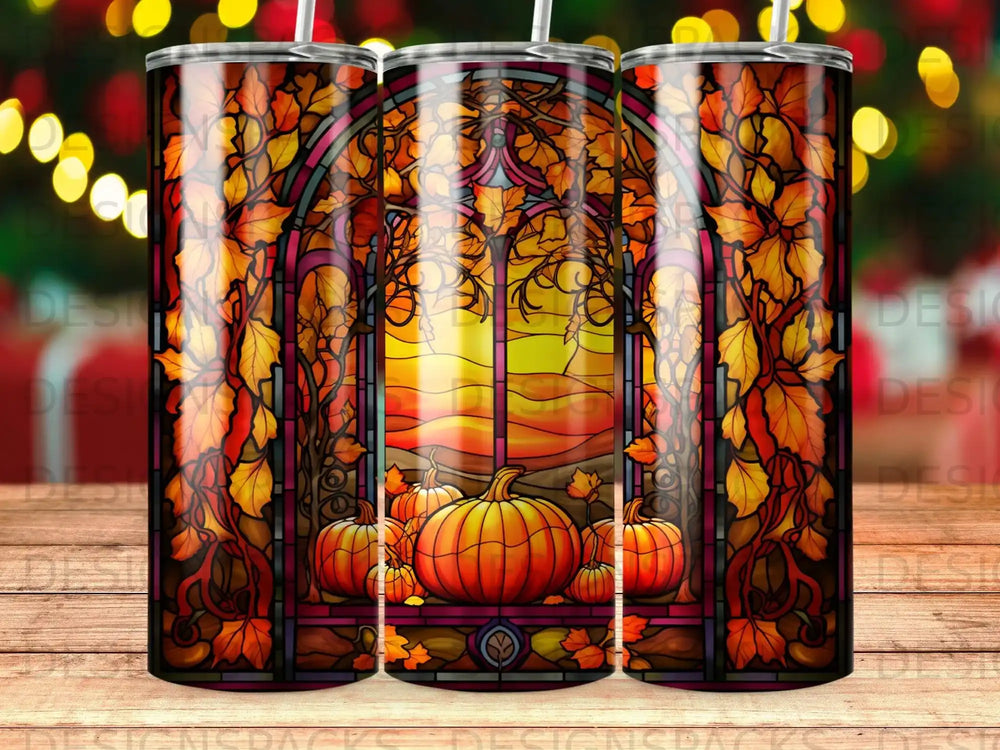Stained glass window with pumpkins and autumn leaves, sunset view.