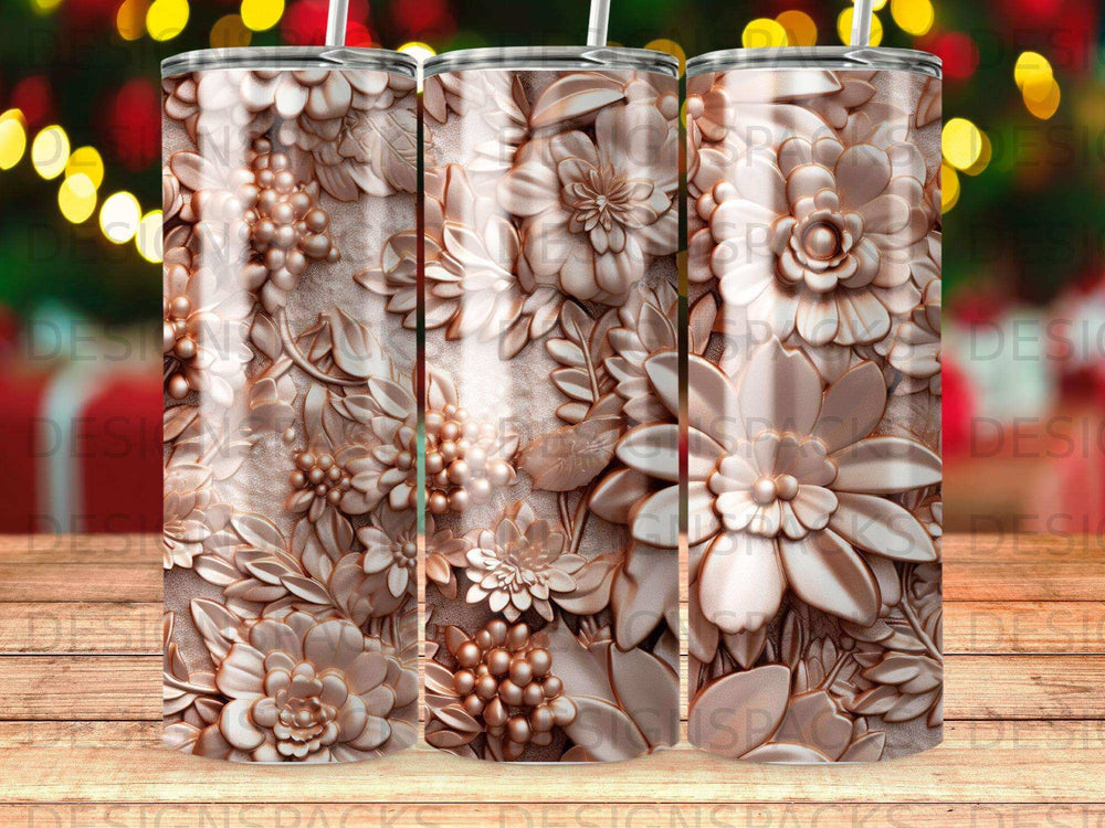Rose gold tumbler with embossed floral and fruit relief design.