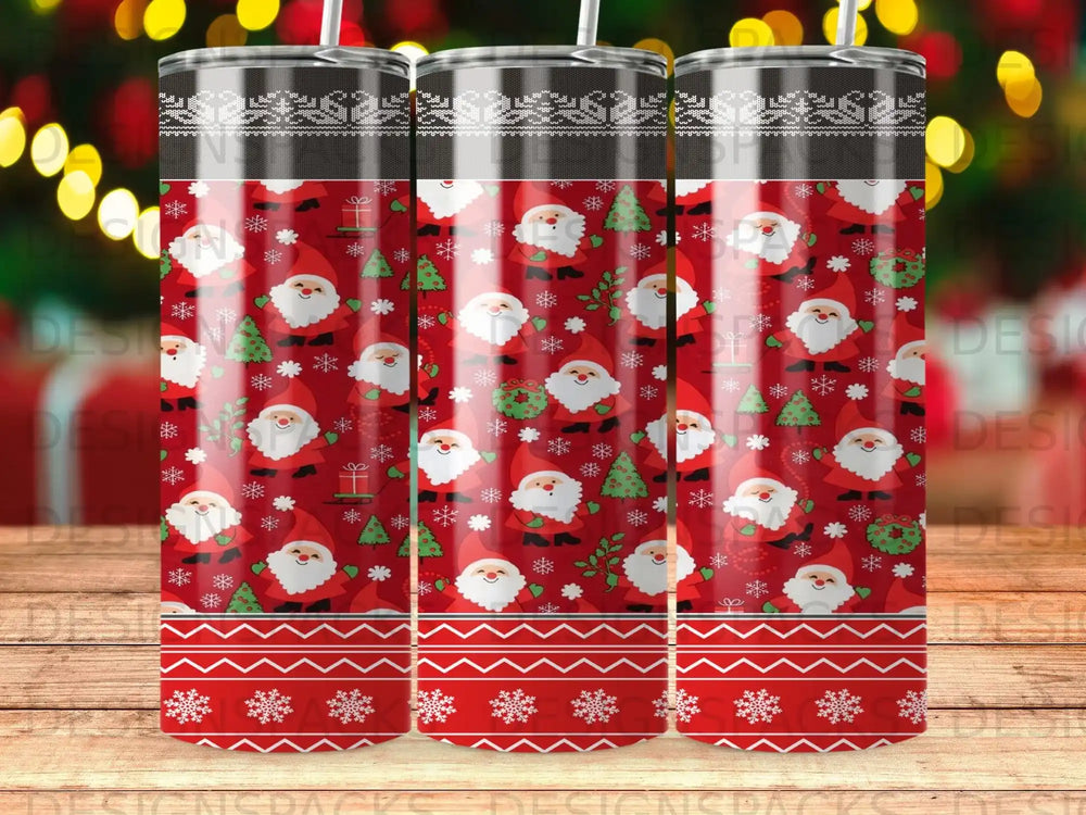 Three tumblers with Santa and Christmas tree pattern.